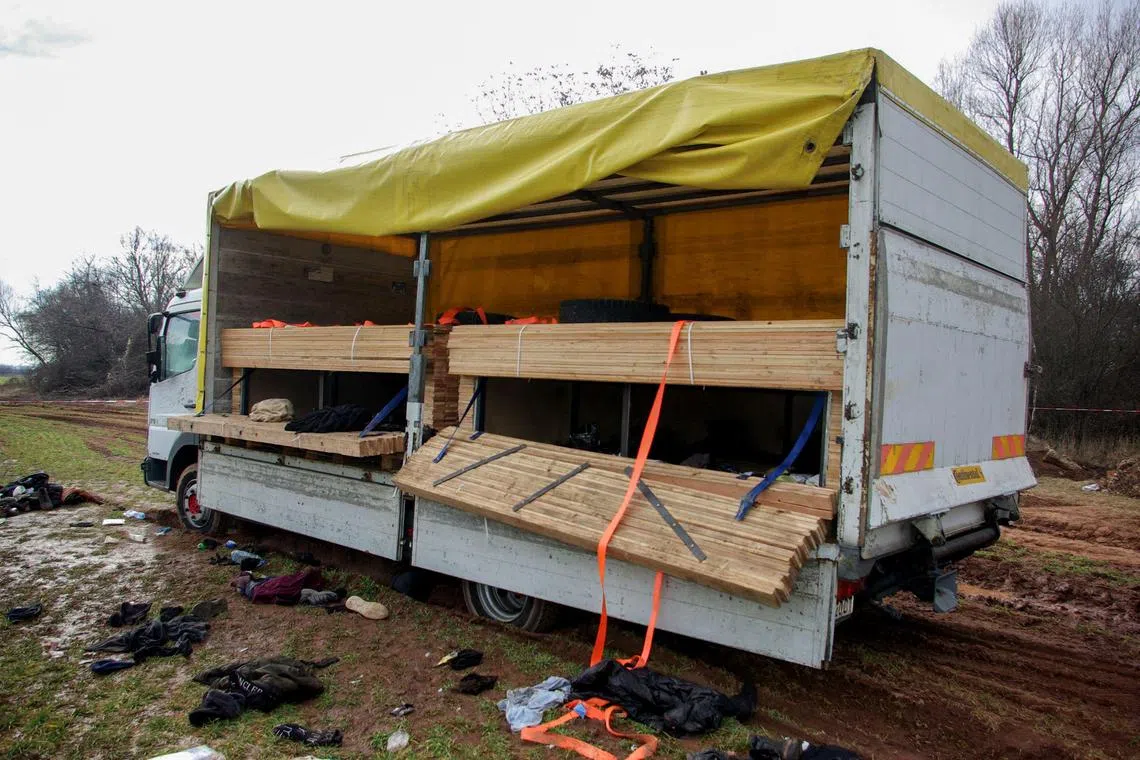 Eighteen Afghan migrants were found dead inside a truck dumped on an dirt road near Bulgaria's capital, Sofia.