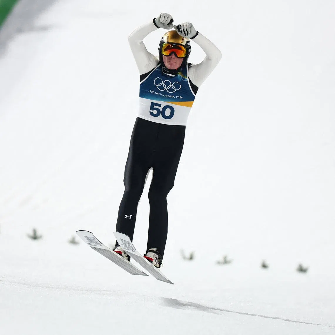 Milano Cortina 2026 Olympics - Ski Jumping - Men's Large Hill Individual - Predazzo Ski Jumping Stadium, Predazzo, Italy - February 14, 2026. Gold medalist Domen Prevc of Slovenia celebrates after winning Men's Large Hill Individual REUTERS/Kacper Pempel