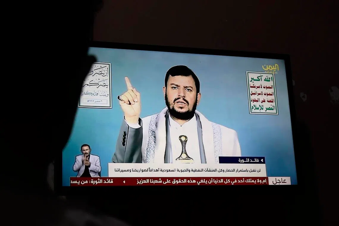 A person watching Houthi leader Abdul Malik al-Houthi deliver a televised address in Sana’a, Yemen, on July 16.