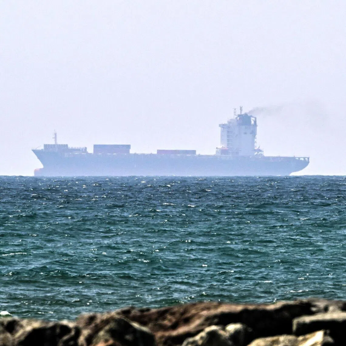 Vessels are seen off the coast of Sharjah in the United Arab Emirates on May 21. Due to the Iran war, 20,000 seafarers remain stranded inside the Gulf on board hundreds of ships.
