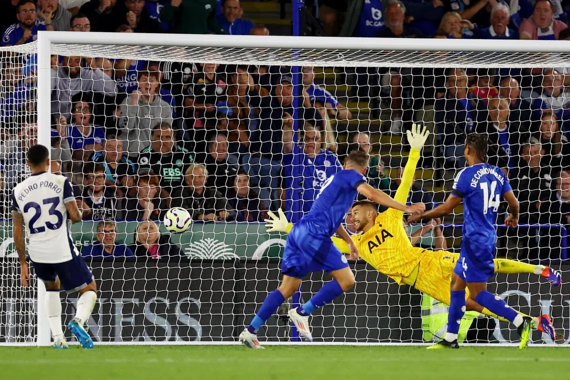 Leicester City striker Jamie Vardy scores the equaliser in the 1-1 English Premier League draw with Tottenham Hotspur.