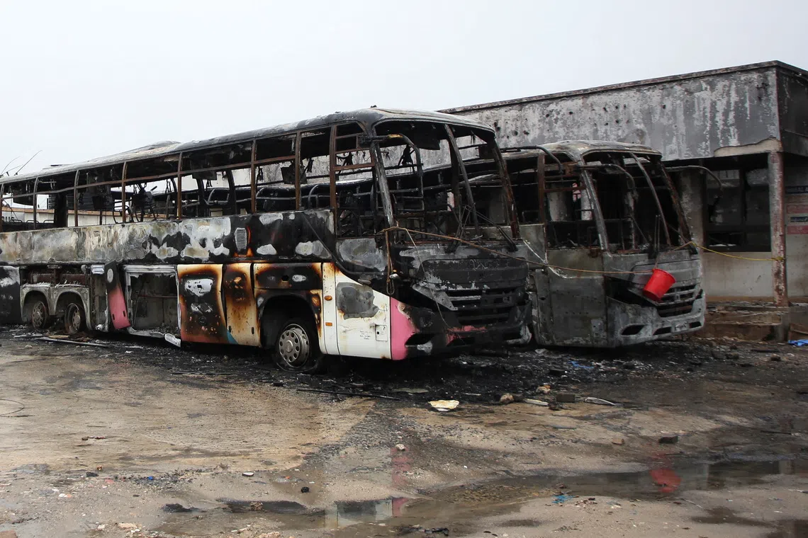 Wrecked buses that were burnt during protests, following a general election marred by violent demonstrations over the exclusion of two leading opposition candidates, stand at the Mwembechai area in Kinondoni district in Dar es Salaam, Tanzania November 4, 2025. REUTERS/Emmanuel Herman