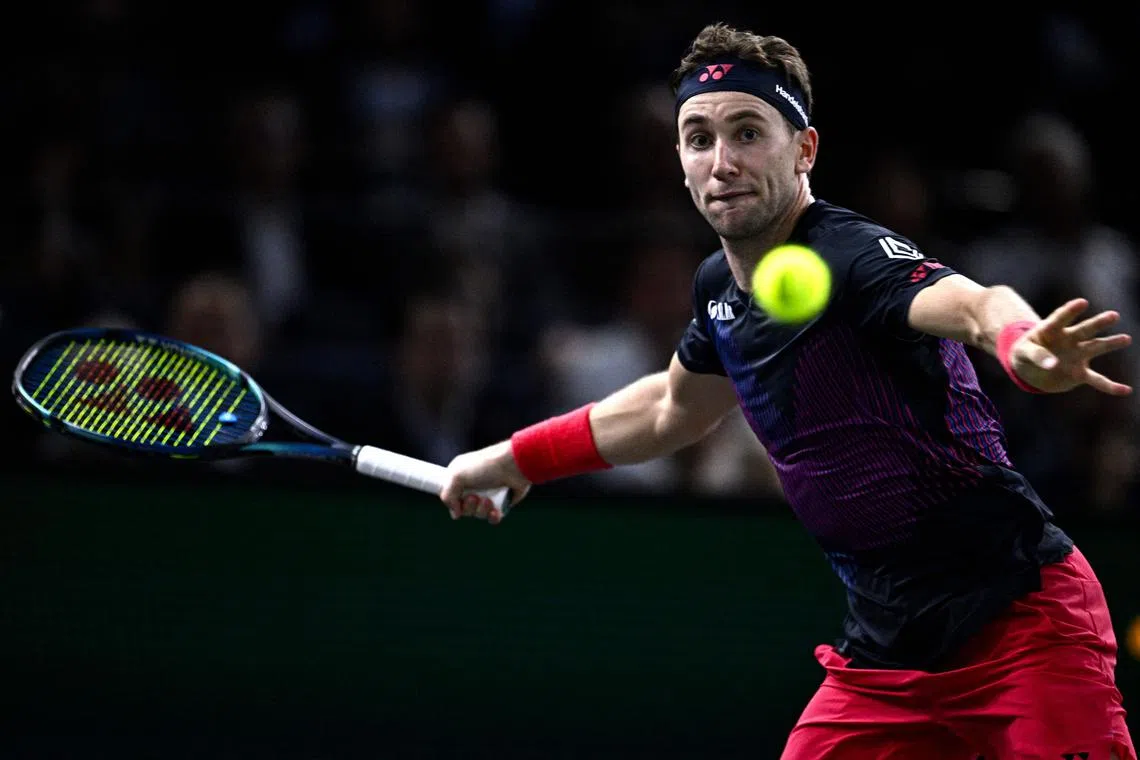 Norway's Casper Ruud eyes the ball as he plays against Australia's Jordan Thompson during the Paris Masters.