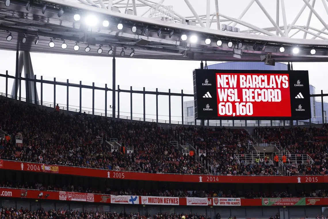 The big screen displaying a new Women’s Super League record match attendance of 60,160 during Arsenal's 3-1 win over Manchester United at the Emirates on Feb 17.