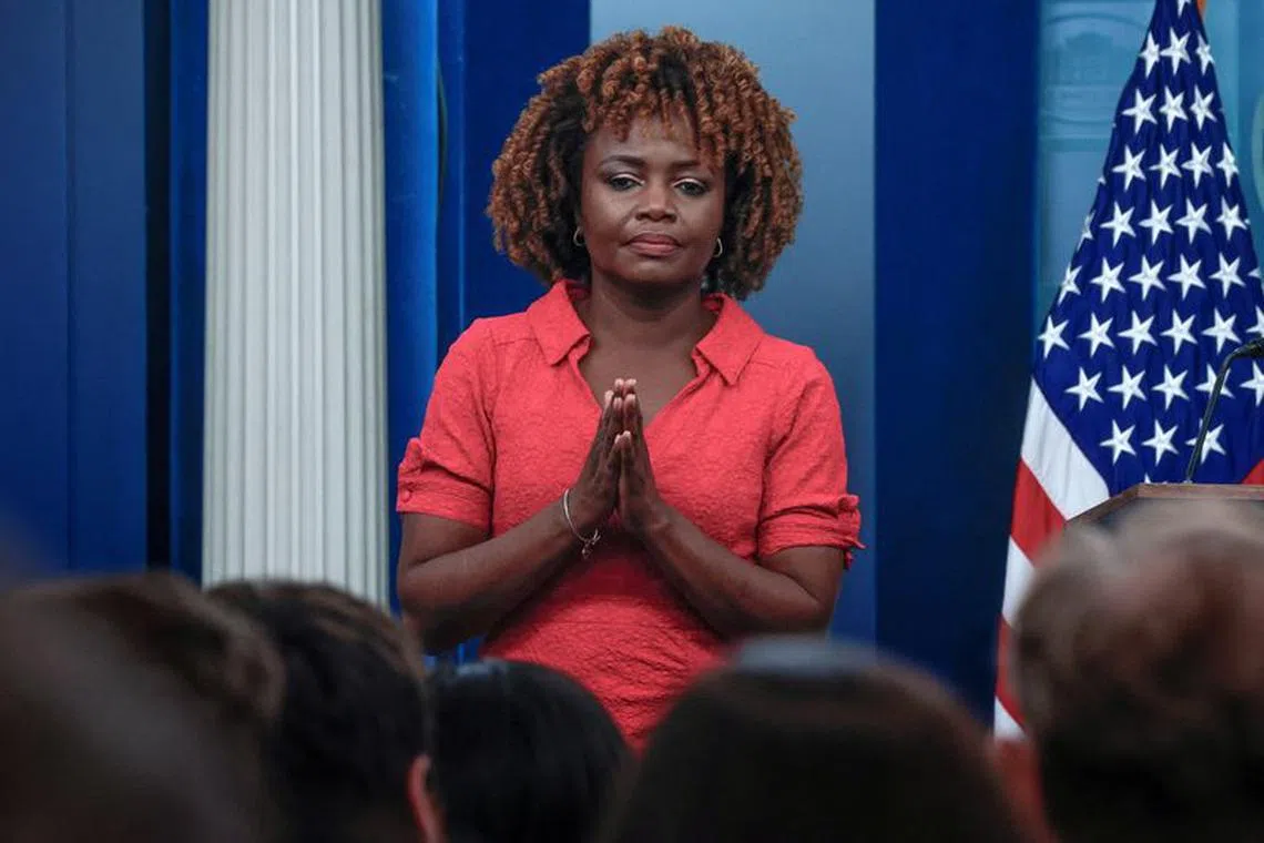 Press Secretary Karine Jean Pierre listens as White House Counsel Spokesperson Ian Sams speaks to reporters during the daily press briefing at the White House in Washington, U.S., February 9, 2024. REUTERS/Evelyn Hockstein