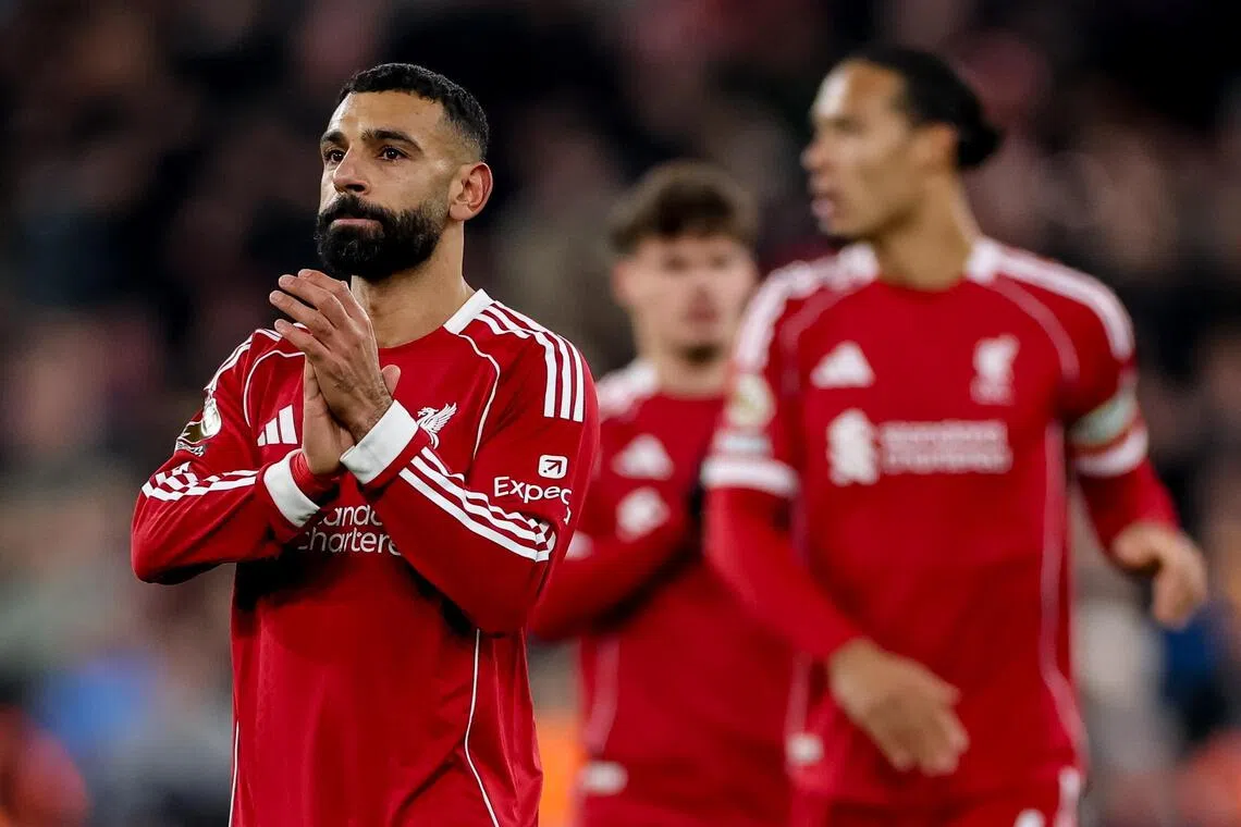 epa12568151 Mohamed Salah of Liverpool (L) greets their supporters after the English Premier League match between Liverpool and Sunderland in Liverpool, Great Britain, 03 December 2025.  EPA/ADAM VAUGHAN EDITORIAL USE ONLY. No use with unauthorized audio, video, data, fixture lists, club/league logos, 'live' services or NFTs. Online in-match use limited to 120 images, no video emulation. No use in betting, games or single club/league/player publications.