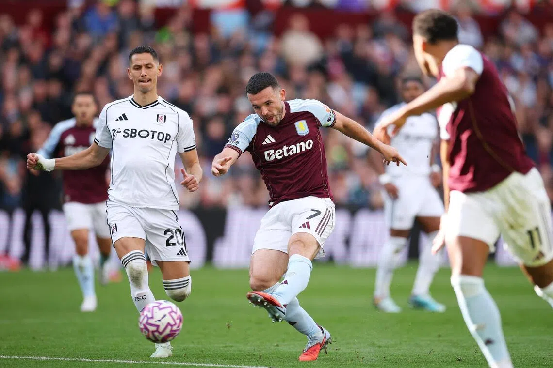 Aston Villa's John McGinn scores against Fulham in their Premier League clash.