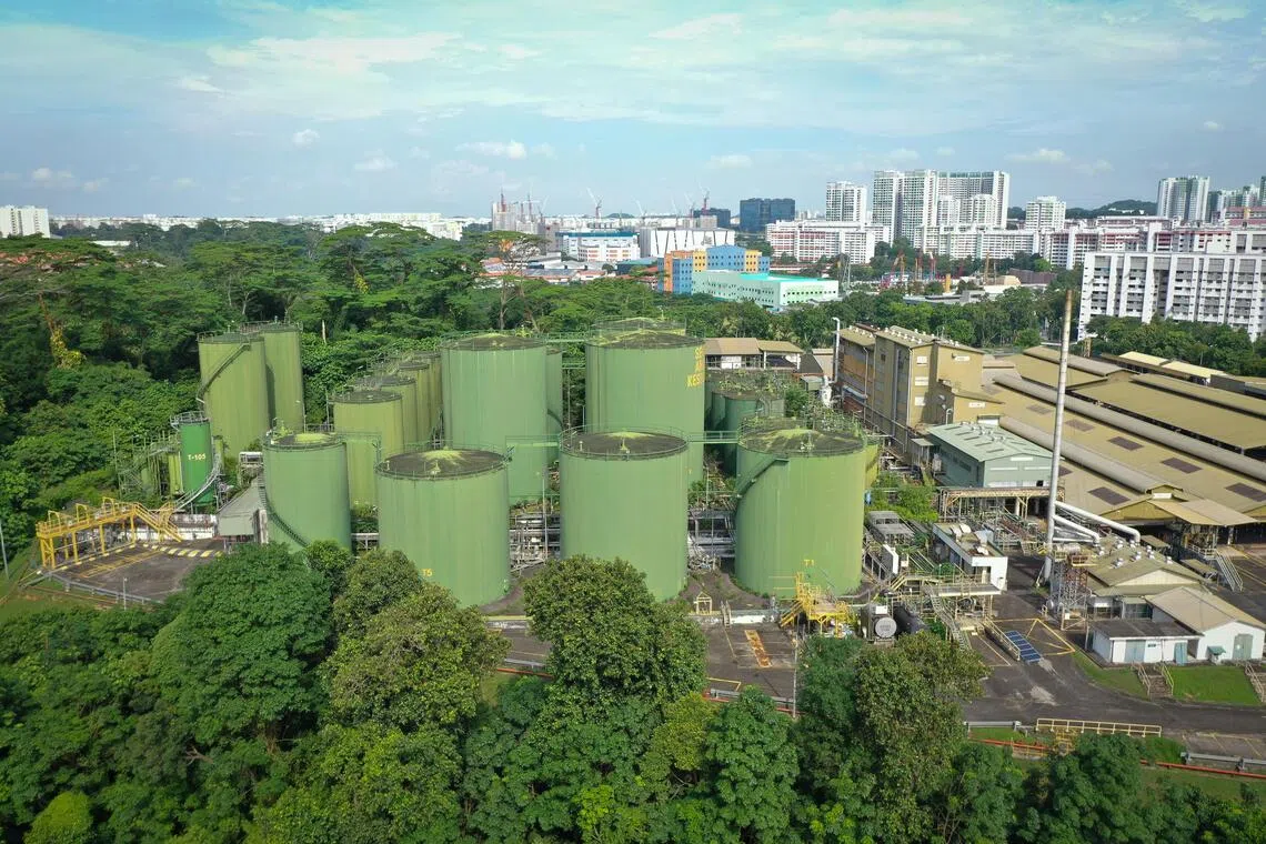 A view of an abandoned blending plant in Singapore, against the backdrop of residential high-rise buildings. 