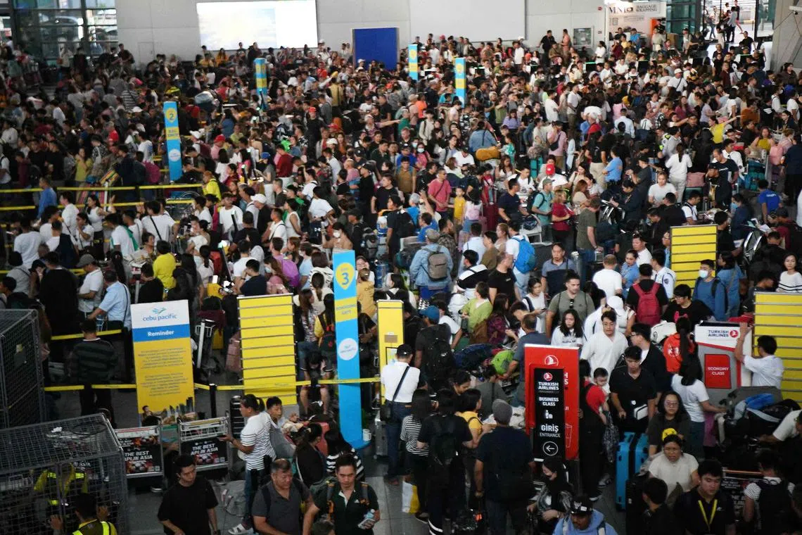 Passengers crowding the departure counters of Cebu Pacific airline at Terminal 3 of Ninoy Aquino International Airport in Manila on July 19, 2024. A major outage wreaked havoc on computer systems worldwide, grounding flights in the United States, disrupting television broadcasts in the UK, and impacting telecommunications in Australia.