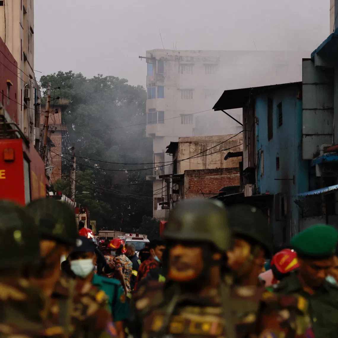 Smoke rises from a building as fire broke out at a garment factory and a chemical warehouse in Dhaka, Bangladesh, October 14, 2025. REUTERS/Mohammad Ponir Hossain