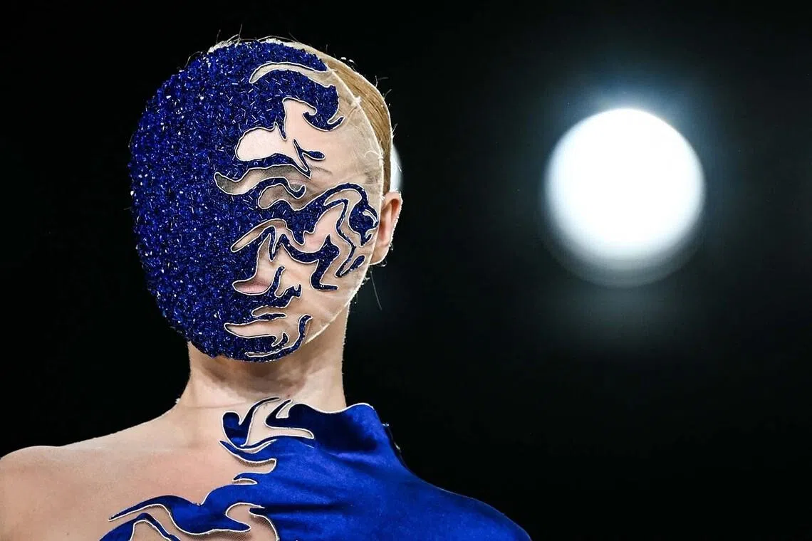 TOPSHOT - A model presents a creation by Iris Van Herpen for the Women Haute Couture Fall/Winter 2026-2027 collection as part of the Paris Fashion Week, in Paris, on July 6, 2026. (Photo by Blanca CRUZ / AFP)