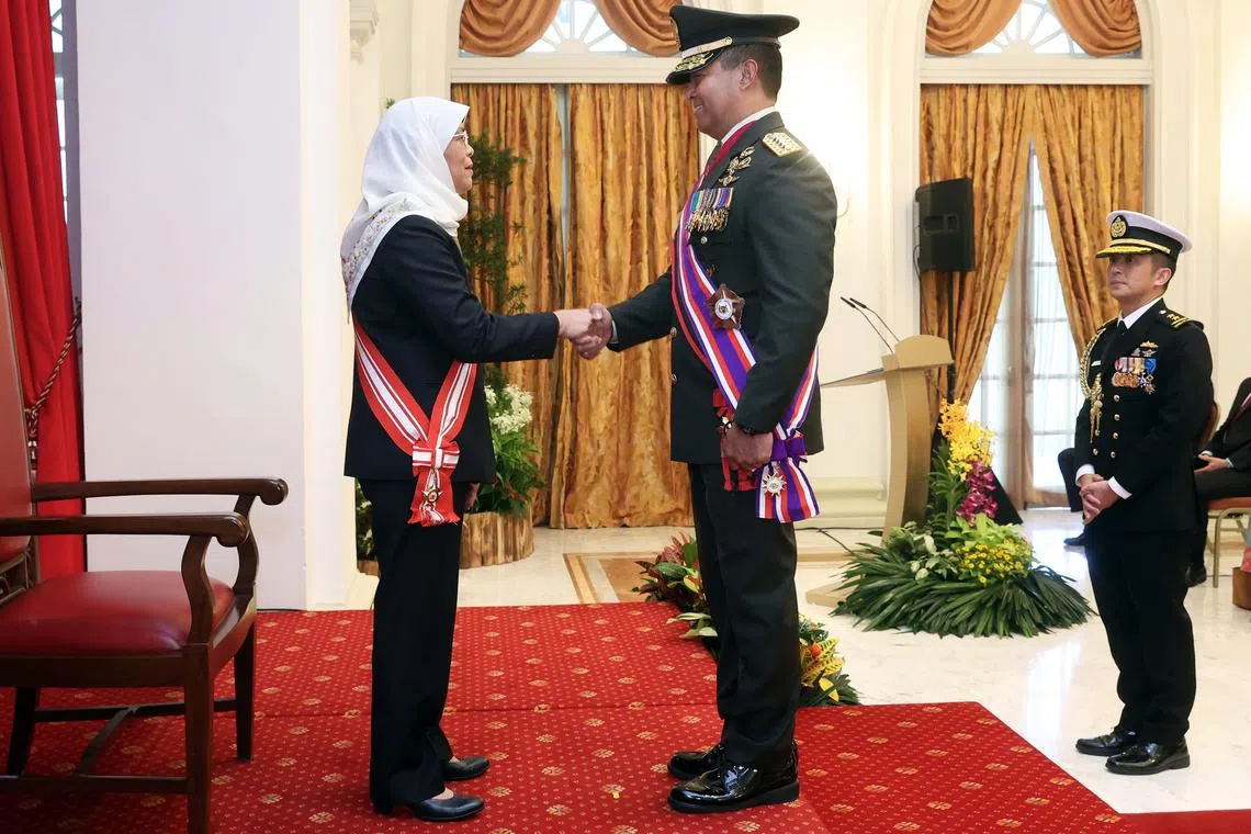 President Halimah Yacob conferring the Distinguished Service Order (Military) to General (Ret) Andika Perkasa at the Istana on Wednesday.