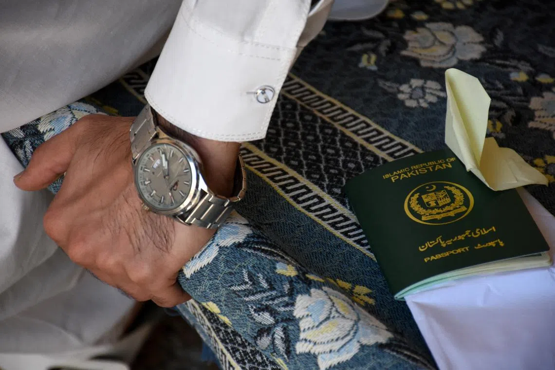 A Pakistani Shi'ite Muslim man, who was working as a building security officer in the United Arab Emirates, speaks with Reuters at his village, after being deported along with many others following the U.S.-Israeli war against Iran, in Chakwal, Pakistan May 5, 2026. REUTERS/Waseem Khan