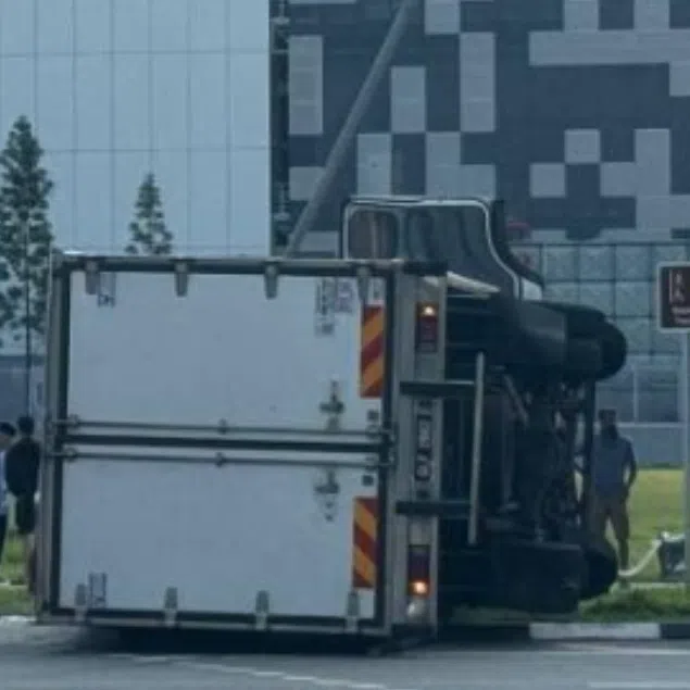 The lorry was believed to have skidded at the junction of Woodlands Avenue 6 and Woodlands Avenue 1.