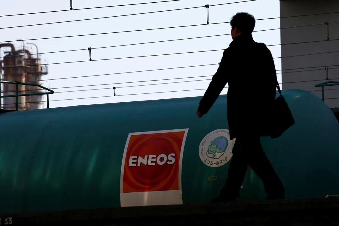 FILE PHOTO: JX Nippon Oil & Energy Corp's Eneos brand logo on a tanker lorry in a train at a station nearby its refinery in Yokohama, Japan February 7, 2017. REUTERS/Kim Kyung-Hoon/File Photo