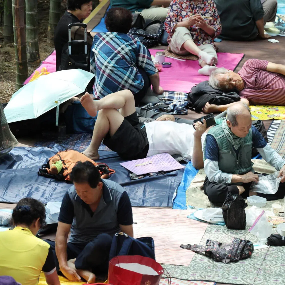 Elderly people at the Incheon International Airport to escape extreme heat during a severe heatwave warning in South Korea on Aug 7.
