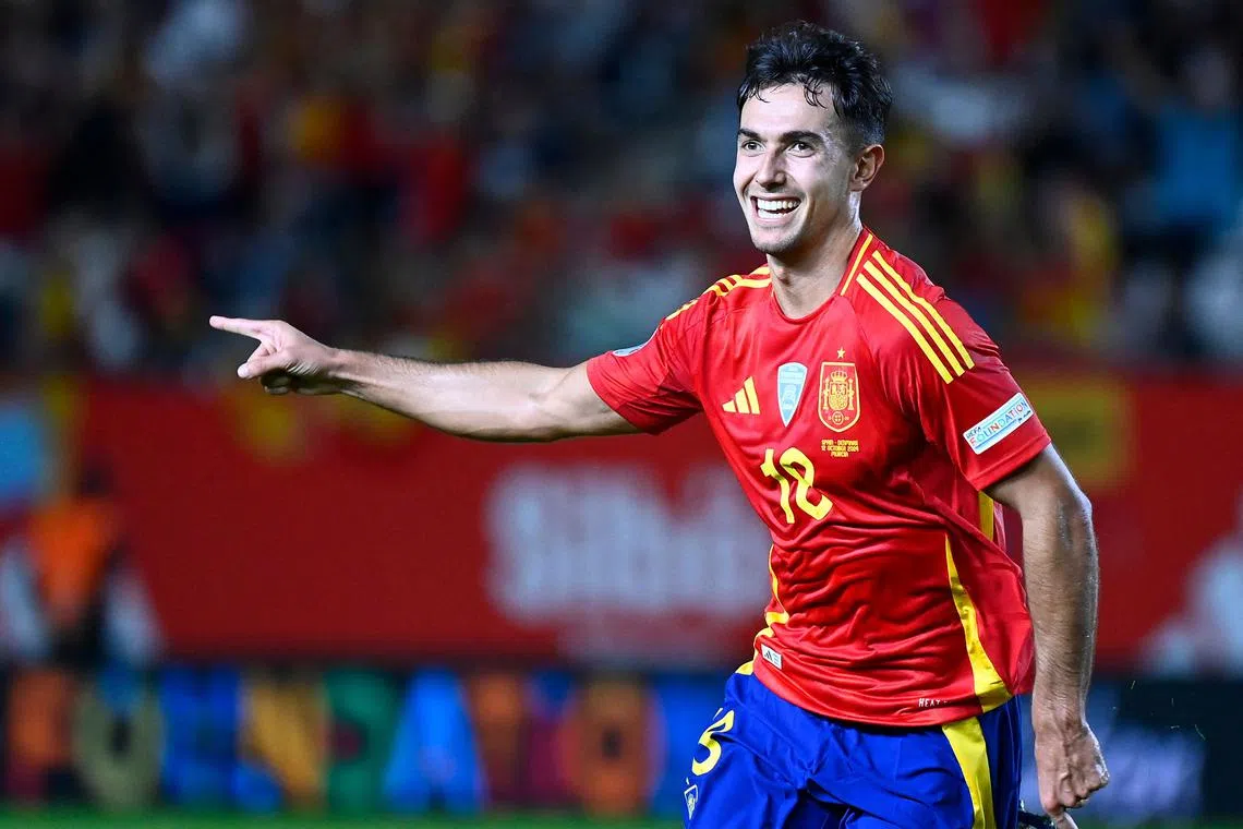 Spain's midfielder Martin Zubimendi celebrates scoring the opening goal against Denmark.