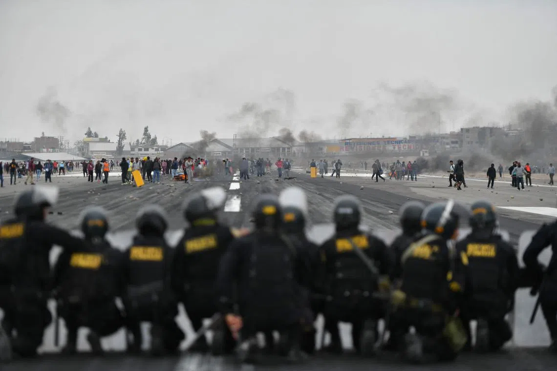 Protestors take over the Alfredo Rodriguez Ballon international airport following the announcement by Peruvian new President Dina Boluarte of her intention of presenting a bill to parliament to advance the scheduled general elections from April 2026 to April 2024 in Arequipa, Peru, on Dec 12, 2022. 
