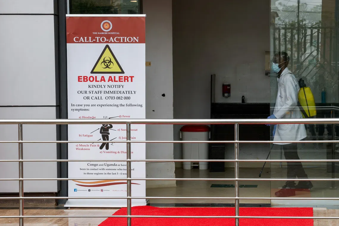 FILE PHOTO: A staff member sanitizes an area at Nairobi Hospital, in Nairobi, Kenya October 7, 2026. REUTERS/Monicah Mwangi/File Photo