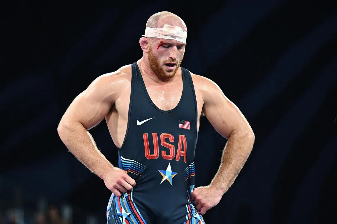 FILE PHOTO: Paris 2024 Olympics - Wrestling - Men's Freestyle 97kg Bronze Medal Match - Champ-de-Mars Arena, Paris, France - August 11, 2024. Kyle Frederick Snyder of United States reacts after losing the match against Amirali Azarpira of Iran. REUTERS/Arlette Bashizi/File Photo