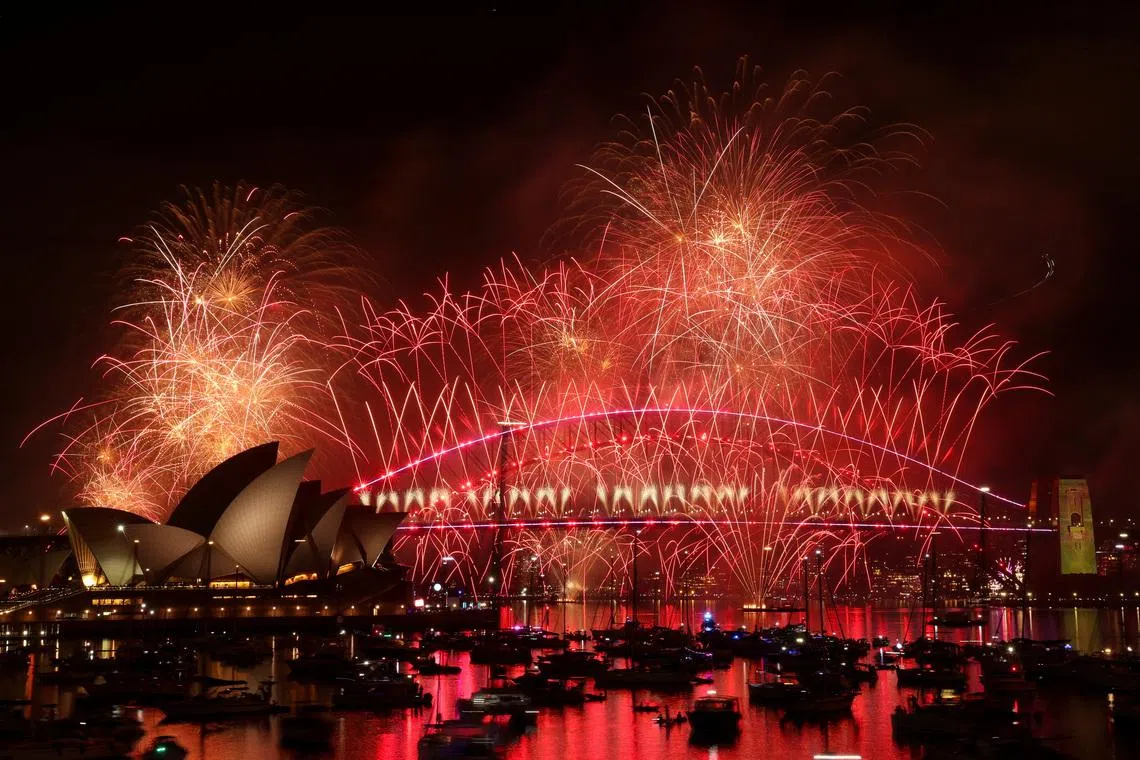 Fireworks explode over Sydney Harbour Bridge to mark the New Year in Sydney, Australia, January 1, 2026. REUTERS/Hollie Adams