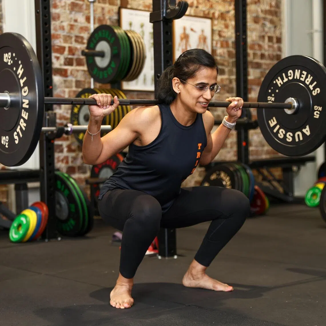 When lifting weights, Mehta goes barefoot. This helps her to avoid compensating for the bunion.