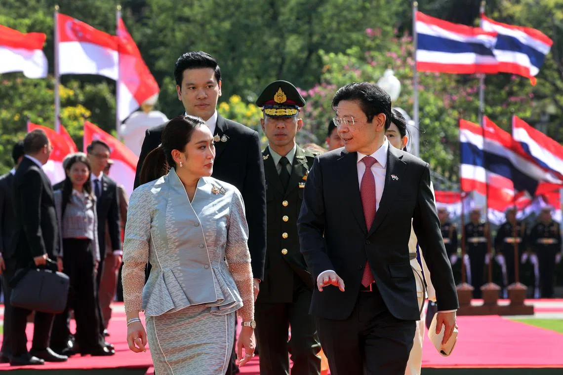 Thai Prime Minister Paetongtarn Shinawatra (left) welcomes Prime Minister Lawrence Wong in Bangkok on Nov 28.