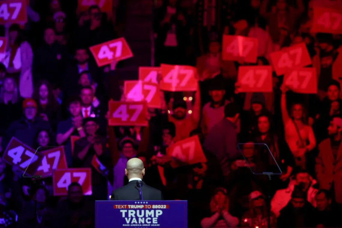Stephen Miller turns towards attendees holding placards reading "47" during a rally for U.S. President-elect Donald Trump the day before he is scheduled to be inaugurated for a second term, in Washington, U.S., January 19, 2025. REUTERS/Evelyn Hockstein