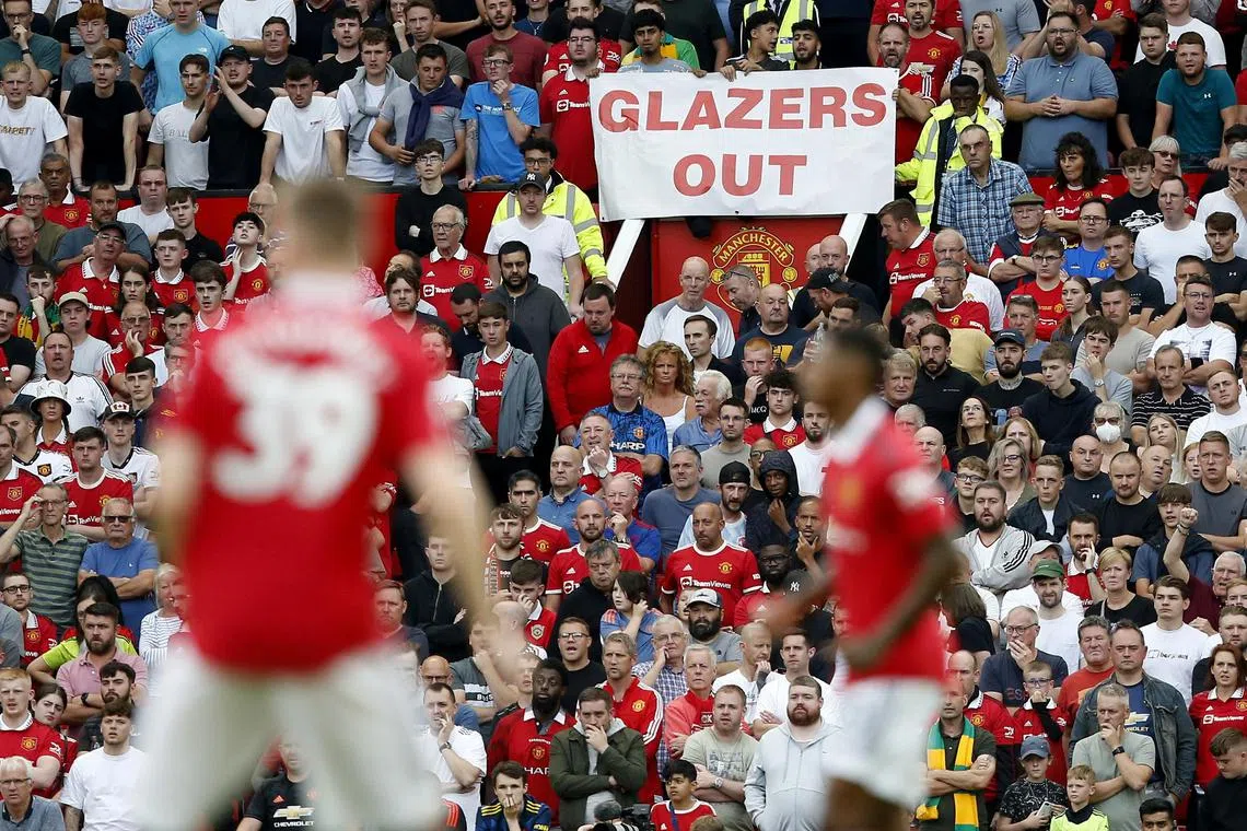 Manchester United fans display a "Glazers out" sign during the Sept 4 match against Arsenal. 