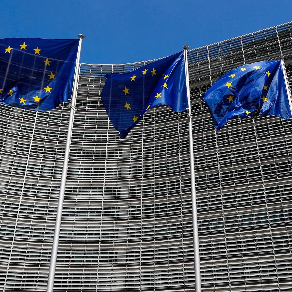 FILE PHOTO: European Union flags flutter outside the EU Commission headquarters in Brussels, Belgium June 20, 2018. REUTERS/Yves Herman/File Photo