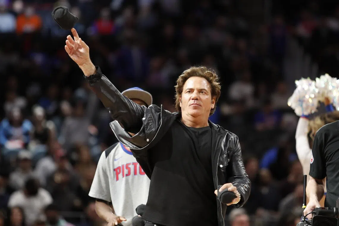 FILE PHOTO: Jan 29, 2019; Detroit, MI, USA; Detroit Pistons owner Tom Gores throws t-shirt into the crowd during the fourth quarter against the Milwaukee Bucks at Little Caesars Arena. Mandatory Credit: Raj Mehta-USA TODAY Sports/File Photo