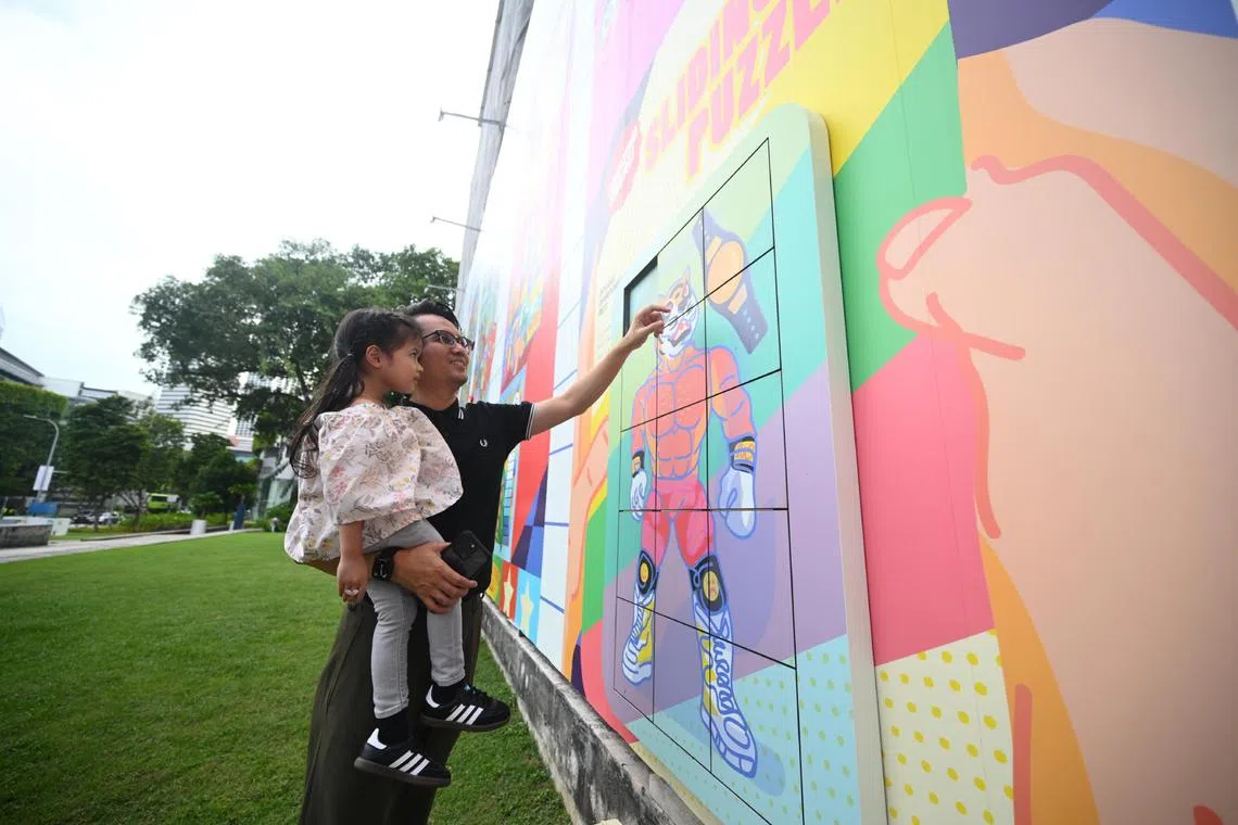 Straits Times correspondent Eddino Abdul Hadi with his daughter at the National Museum of Singapore’s new experiential pop-up centred on the theme of toys.