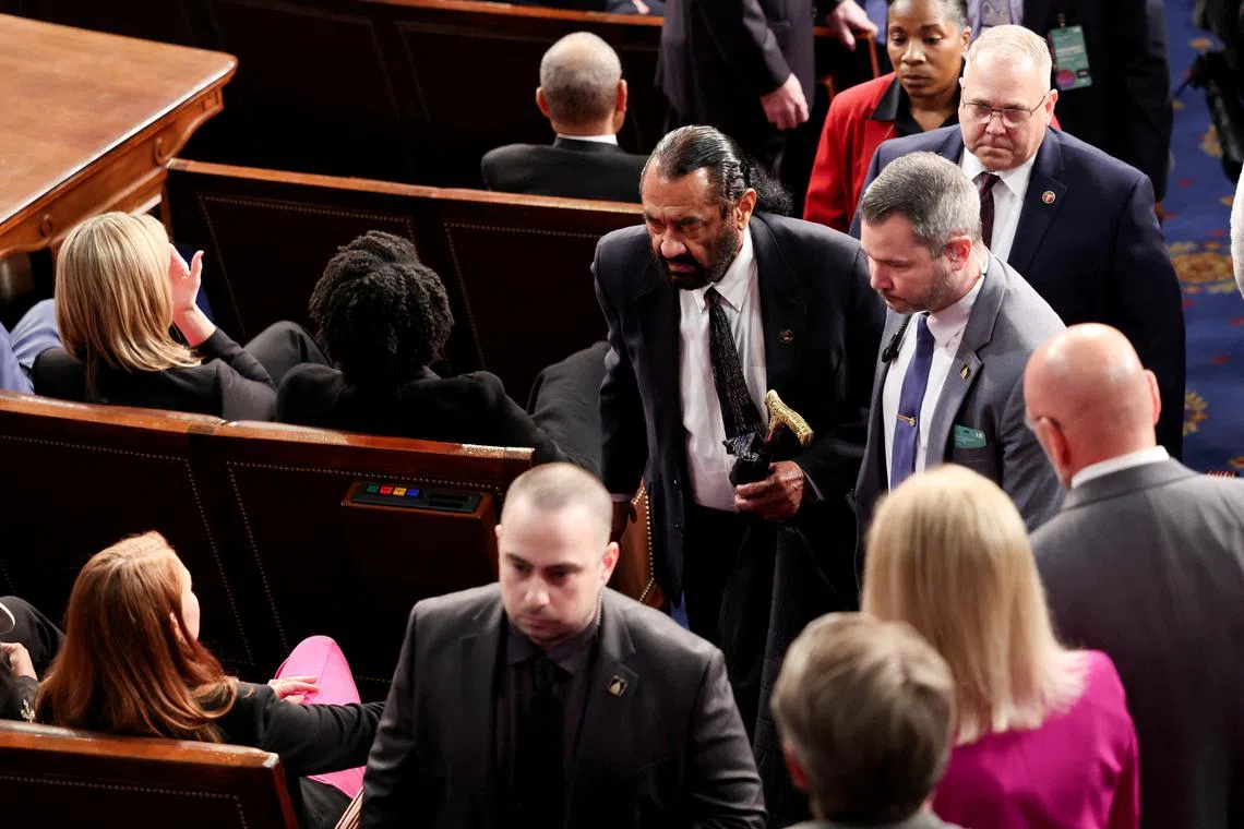 FILE PHOTO: U.S. Rep. Al Green (D-TX) is escorted out after shouting during U.S. President Donald Trump's speech to a joint session of Congress, in the House Chamber of the U.S. Capitol in Washington, D.C., U.S., March 4, 2025.