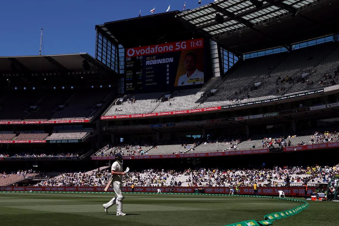 FILE PHOTO: Cricket - Ashes - Third Test - Australia v England - Melbourne Cricket Ground, Melbourne, Australia - December 28, 2021 England's Ollie Robinson walks off after losing his wicket REUTERS/Loren Elliott/File photo