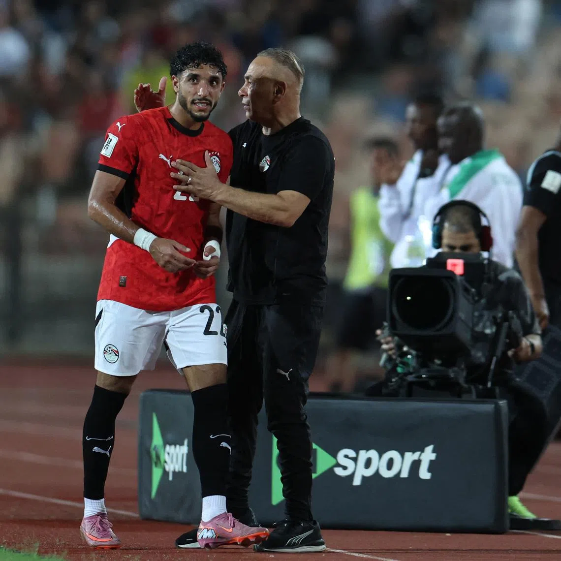 Soccer Football - World Cup - CAF Qualifiers - Group A - Egypt v Ethiopia - Cairo International Stadium, Cairo, Egypt - September 5, 2025  Egypt's Omar Marmoush with Egypt coach Hossam Hassan after being substituted REUTERS/Amr Abdallah Dalsh
