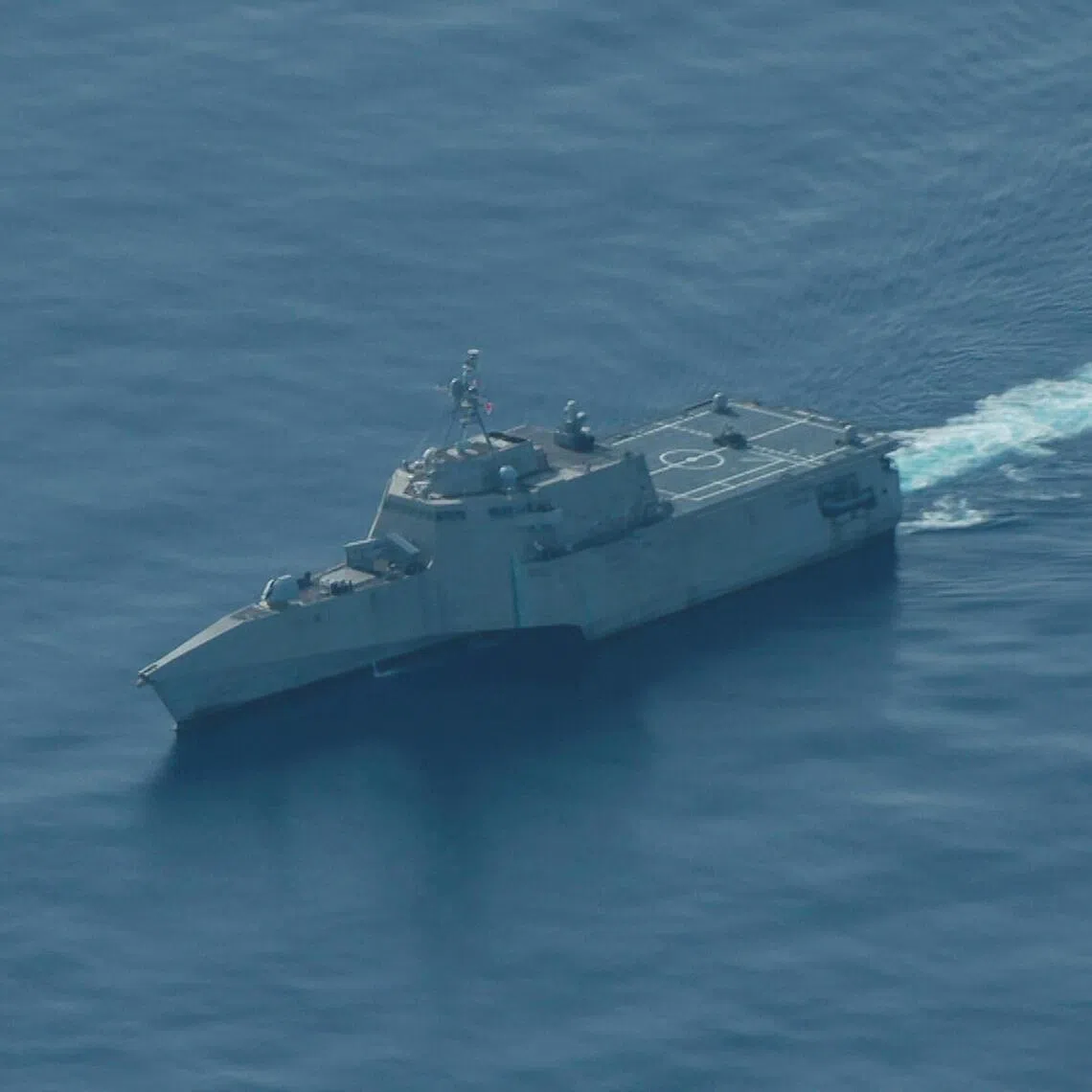 The USS Cincinnati littoral combat ship navigates near the disputed Scarborough shoal off the Philippines’ main coastline.