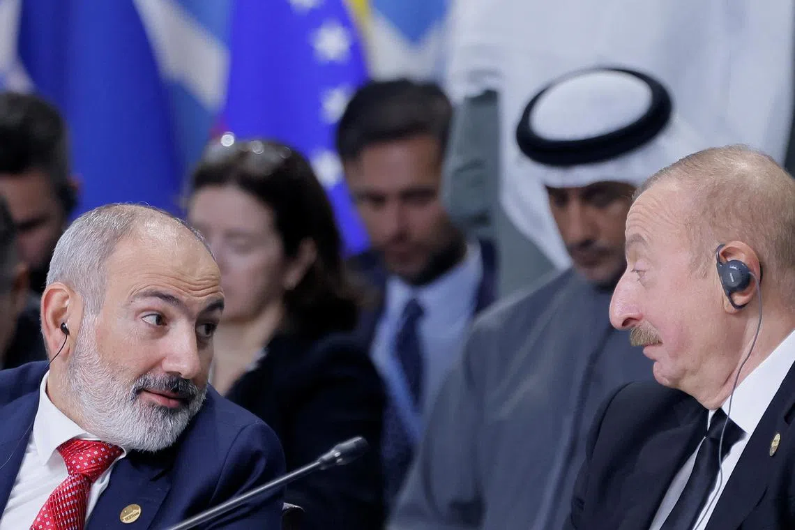 FILE PHOTO: Azerbaijan's President Ilham Aliyev and Armenia's Prime Minister Nikol Pashinyan attend a plenary session in the outreach/BRICS Plus format at the BRICS summit in Kazan, Russia October 24, 2024. REUTERS/Maxim Shemetov/Pool/File Photo