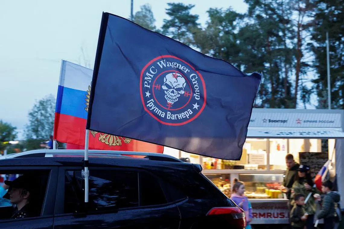A flag with the logo of Wagner private mercenary group is attached to a car during an automobile rally at a patriotic festival marking Russia's National Flag Day in the Moscow region, Russia, August 23, 2023. REUTERS/Yulia Morozova/File Photo