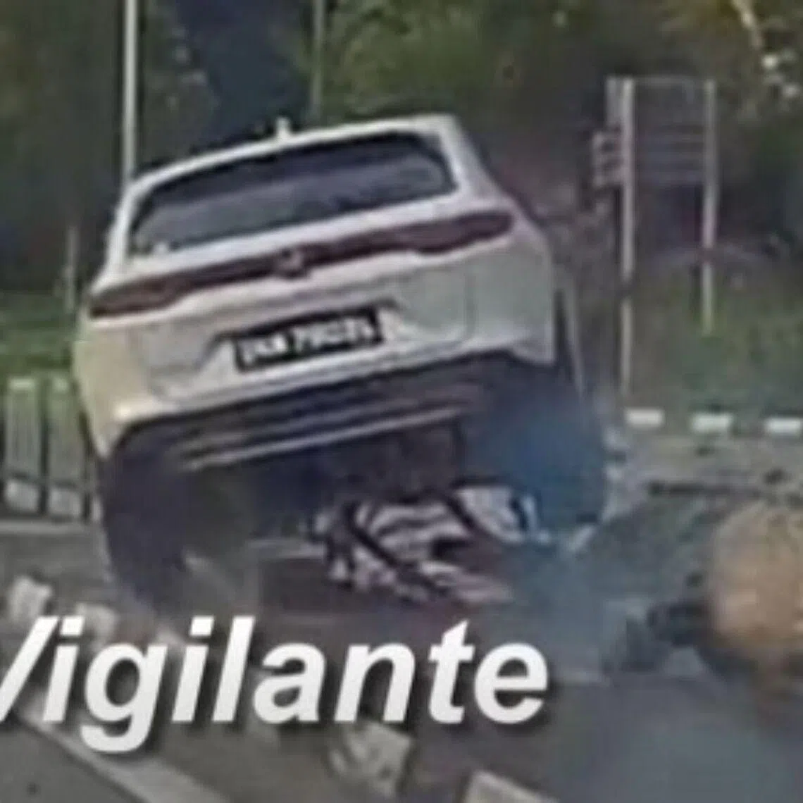 In video footage of the incident circulating online, a white car can be seen driving across the road divider.