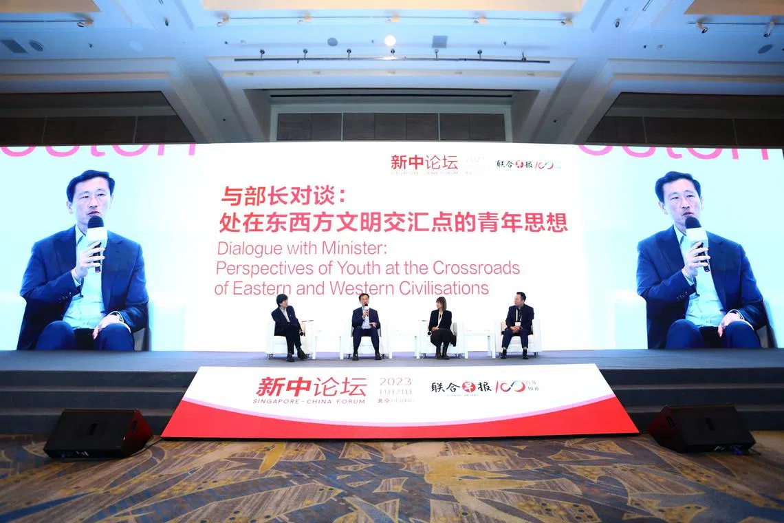 Health Minister Ong Ye Kung (second from left) speaking at a debate at a youth forum in Beijing on Nov 21.