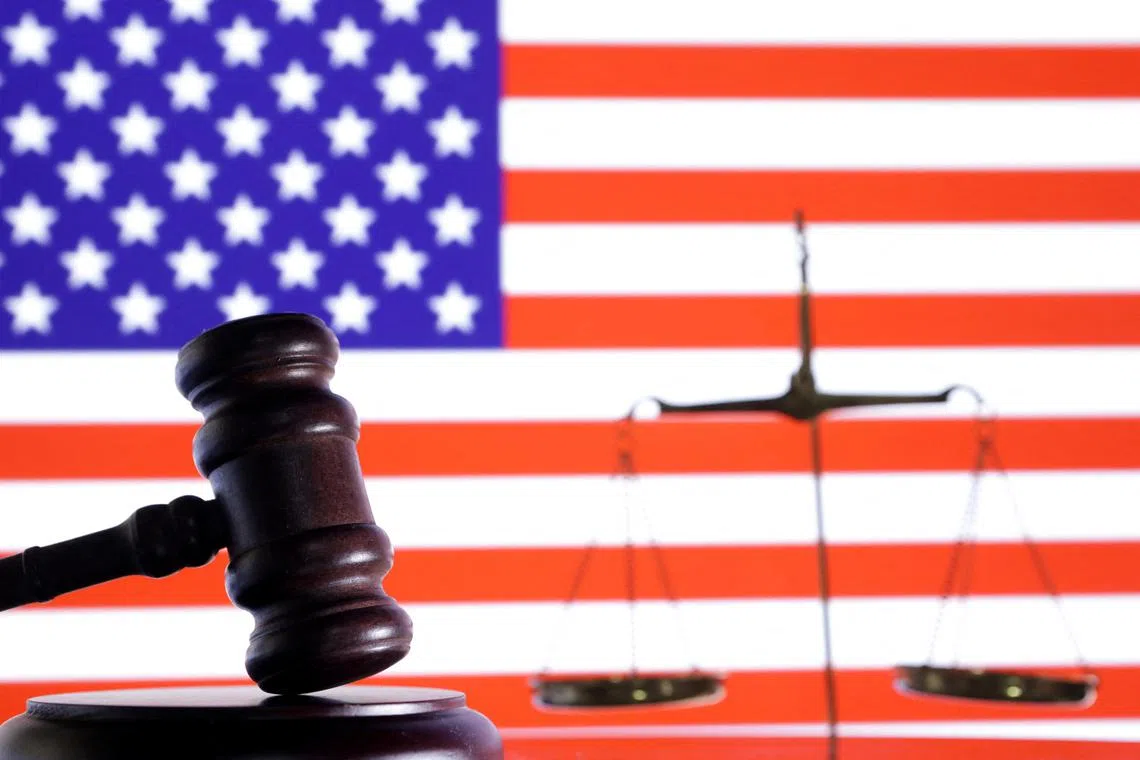 The U.S. flag, a judge gavel and a vintage scale are seen in this illustration taken August 6, 2024. REUTERS/Dado Ruvic/Illustration/File Photo