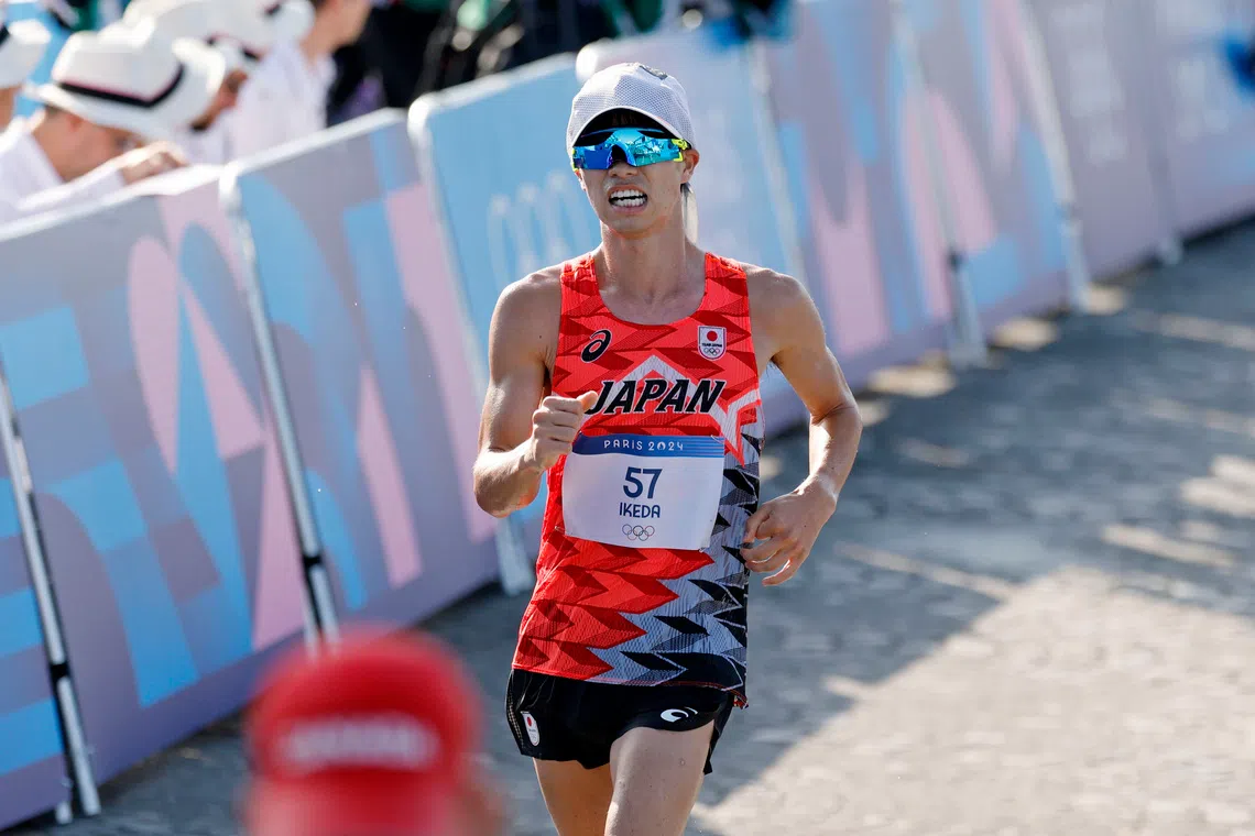Aug 1, 2024; Paris, France; Koki Ikeda (JPN) competes in the men’s 20km race walk during the Paris 2024 Olympic Summer Games at Pont d'Iéna. Mandatory Credit: Yukihito Taguchi-USA TODAY Sports