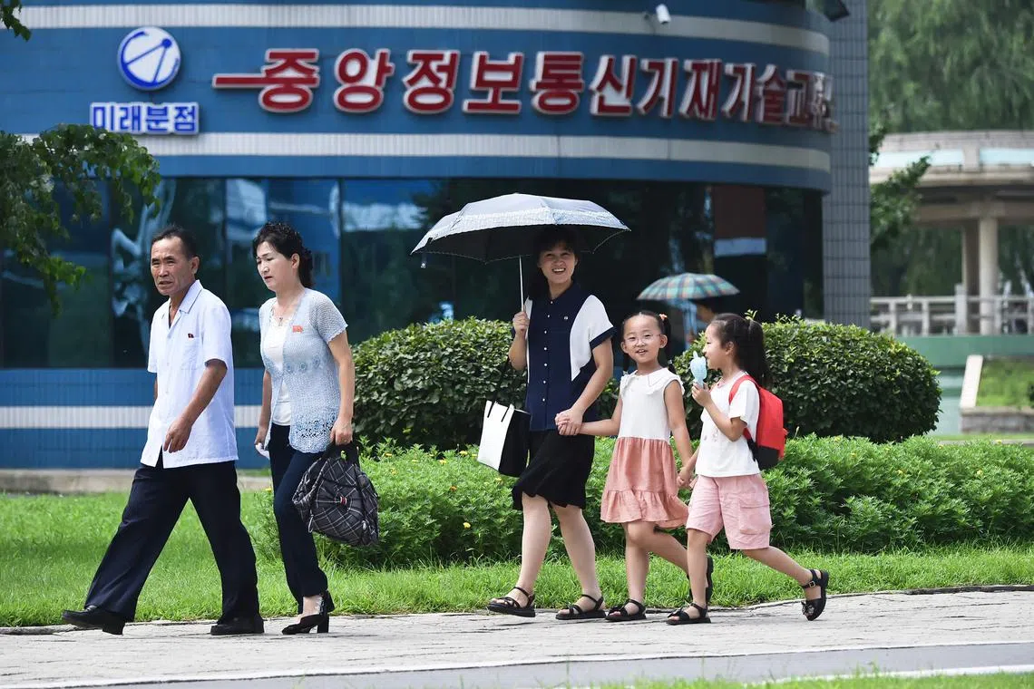 AFP images showed Pyongyang residents using umbrellas and portable fans to keep cool.