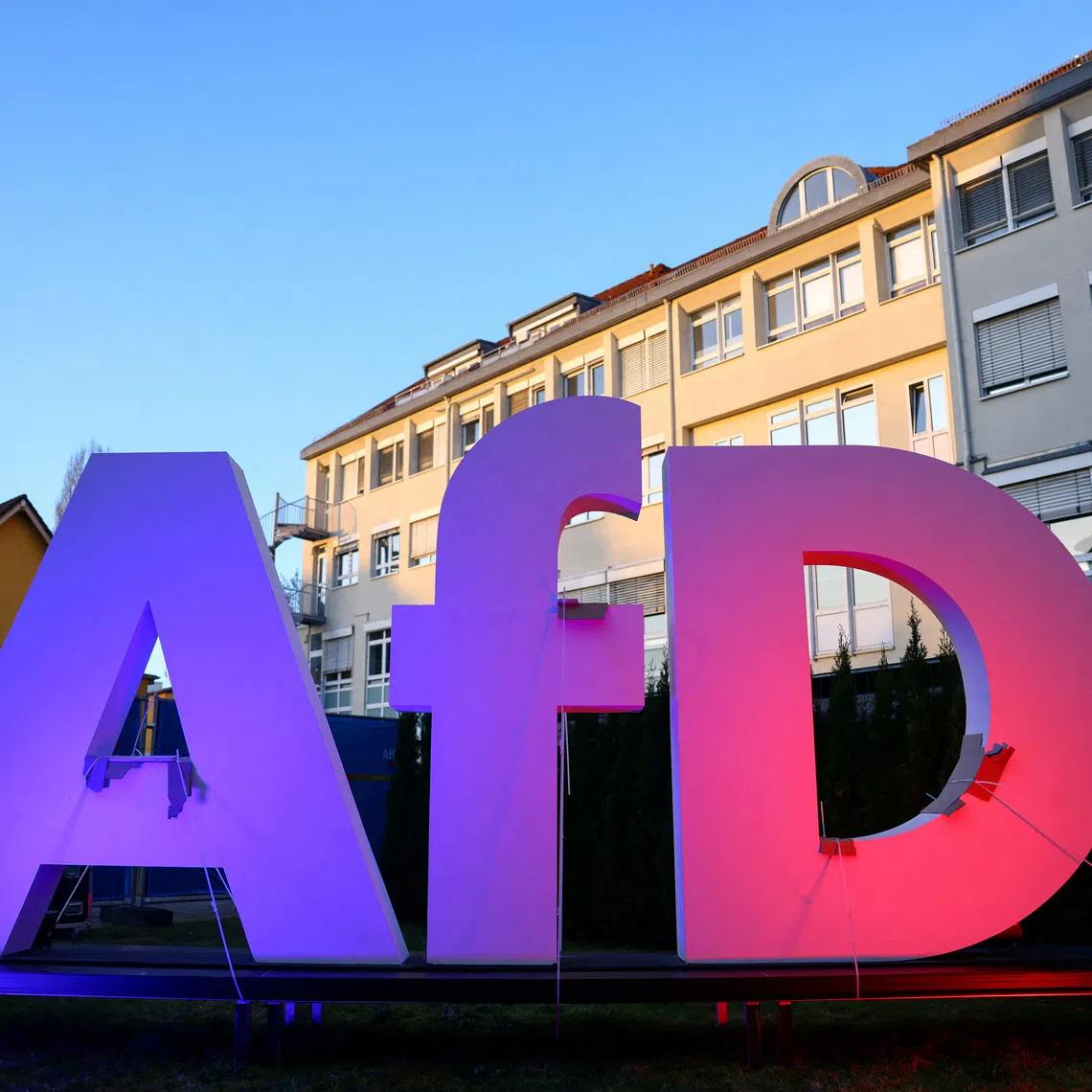 FILE PHOTO: A logo of Germany's far-right Alternative for Germany (AfD) party is illuminated at AfD headquarters during the 2025 general election, in Berlin, Germany, February 23, 2025. REUTERS/Nadja Wohlleben/File Photo