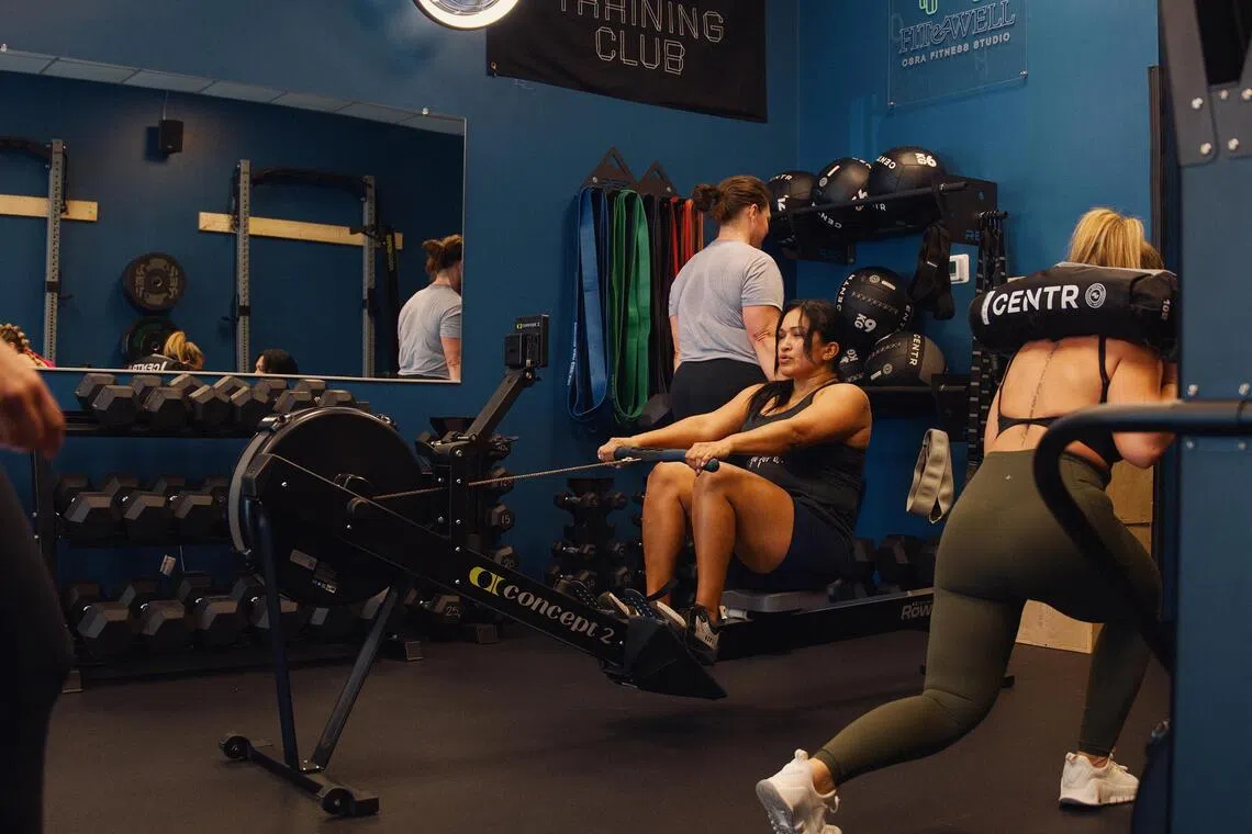 People participate in a Hyrox workout class at CrossTown Fitness, a Hyrox partner, in Chicago on March 31, 2026. The fitness race has seen massive growth in recent years. 