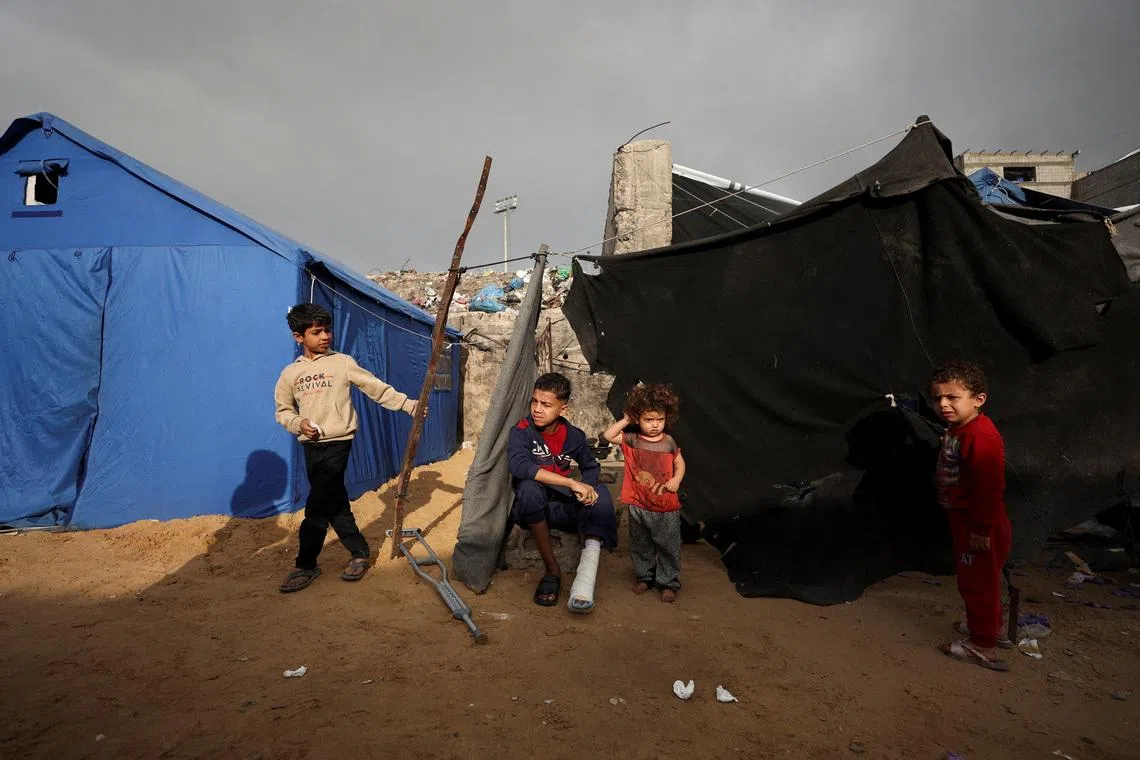 Displaced Palestinian children gather at a tent camp in Gaza City, February 3, 2026. REUTERS/Dawoud Abu Alkas/File Photo