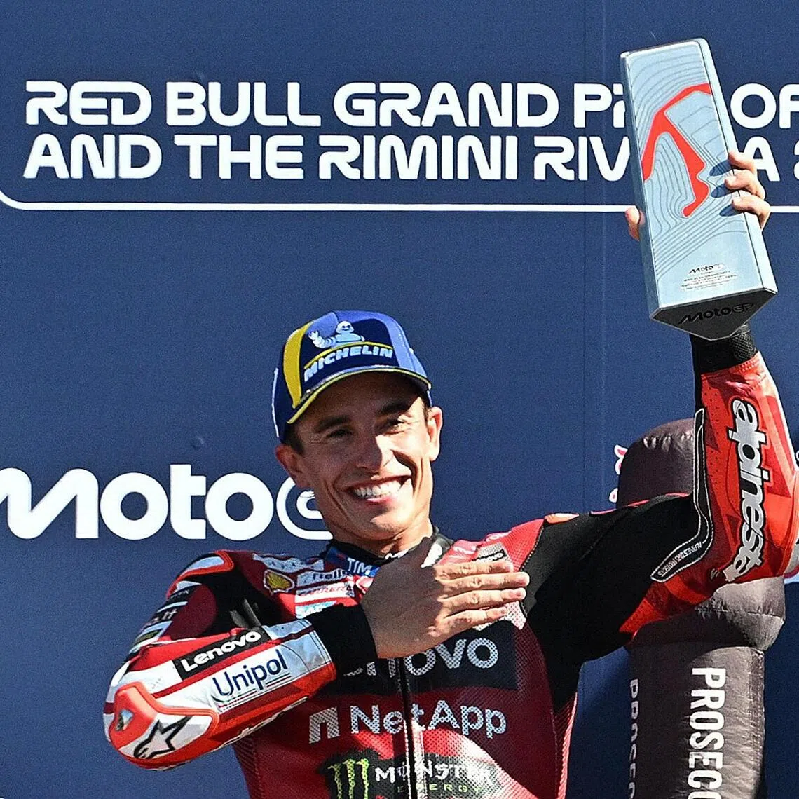 MotoGP - San Marino Grand Prix - Misano World Circuit Marco Simoncelli, Misano, Italy - September 13, 2026
Ducati Lenovo Team's Marc Marquez celebrates with a trophy on the podium after winning the MotoGP race REUTERS/Jennifer Lorenzini
