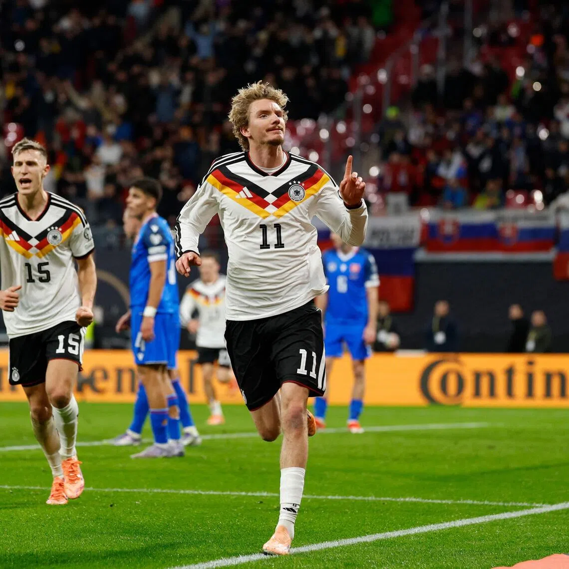 Germany forward Nick Woltemade celebrates scoring his team's first goal in the 6-0 World Cup qualifying win over Slovakia in Leipzig on Nov 17, 2025.