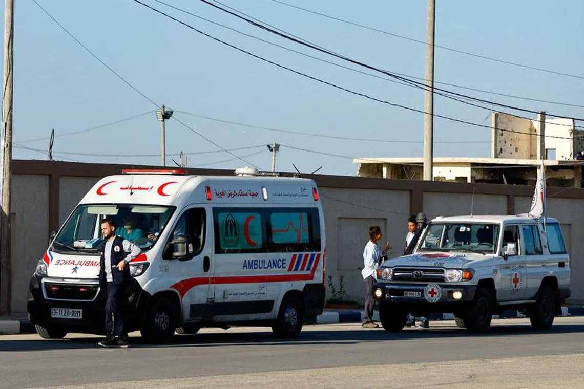 FILE PHOTO: An ambulance for injured Palestinians who will be transported to receive treatments at Egyptian hospitals, waits to move towards the Egyptian side of Rafah crossing, in Rafah in the southern Gaza Strip, November 7, 2023. REUTERS/Ibraheem Abu Mustafa/File photo