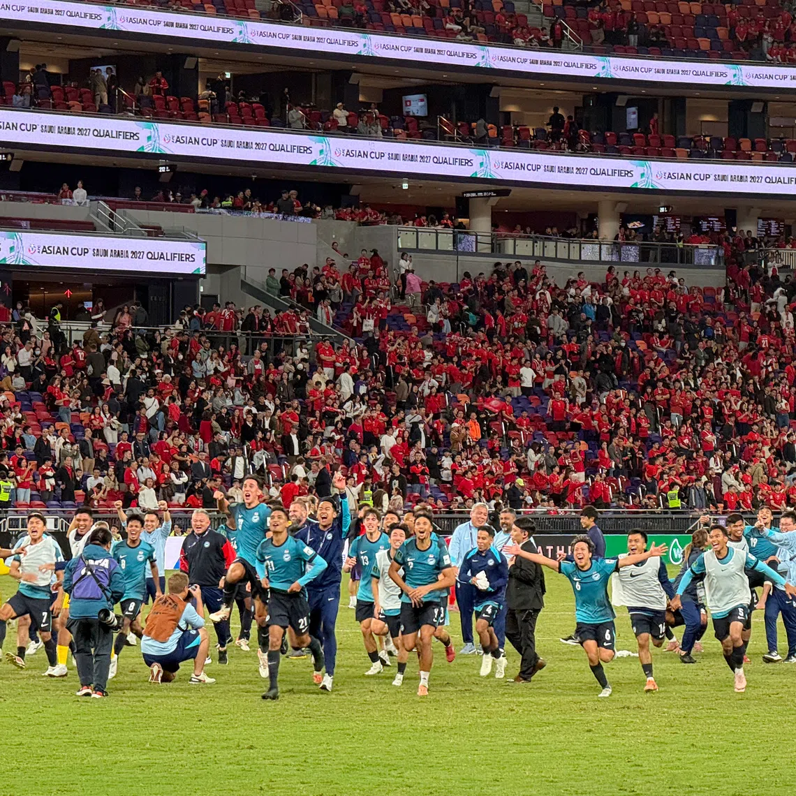 The Singapore team celebrating at the Kai Tak Stadium after beating Hong Kong 2-1 at Asian Cup qualifiers Group C match on Nov 18.